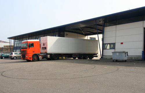 Refrigerated Truck Leaving The Loading Dock - refrigerated trailer rental