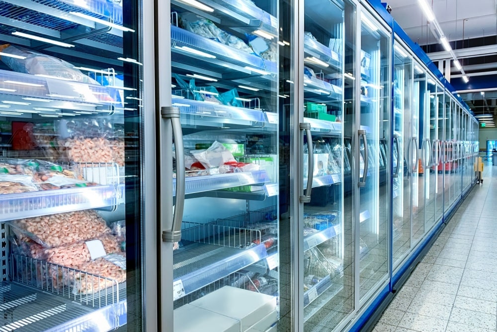 grocery store refrigerator with various refrigerated food